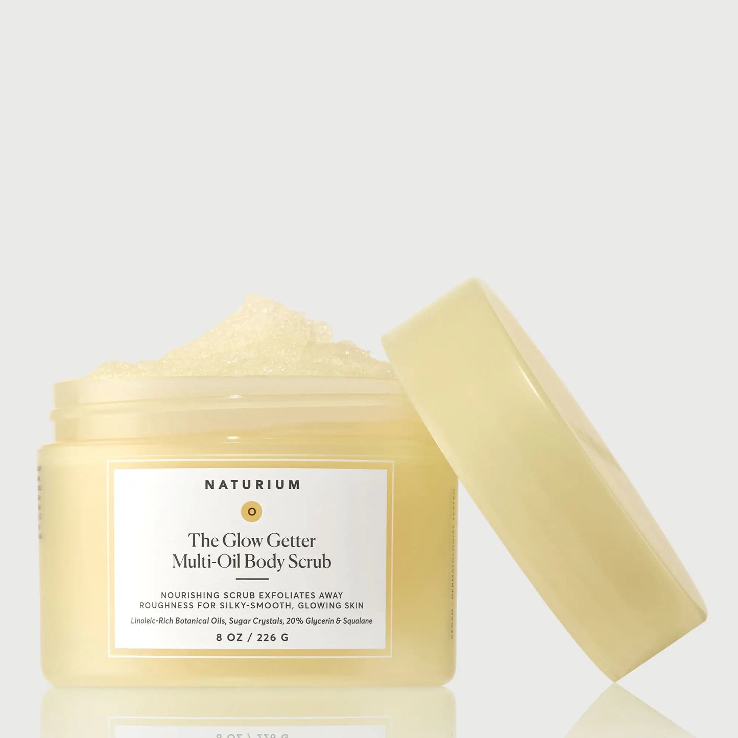 the-glow-getter-multi-oil-body-scrub-n0 NATR-40028-GlowGetter-Multi-Oil-Body-Scrub-Front-CapOff-bonebkgd.webp